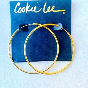 Vintage Cookie Lee large gold hoop earrings.